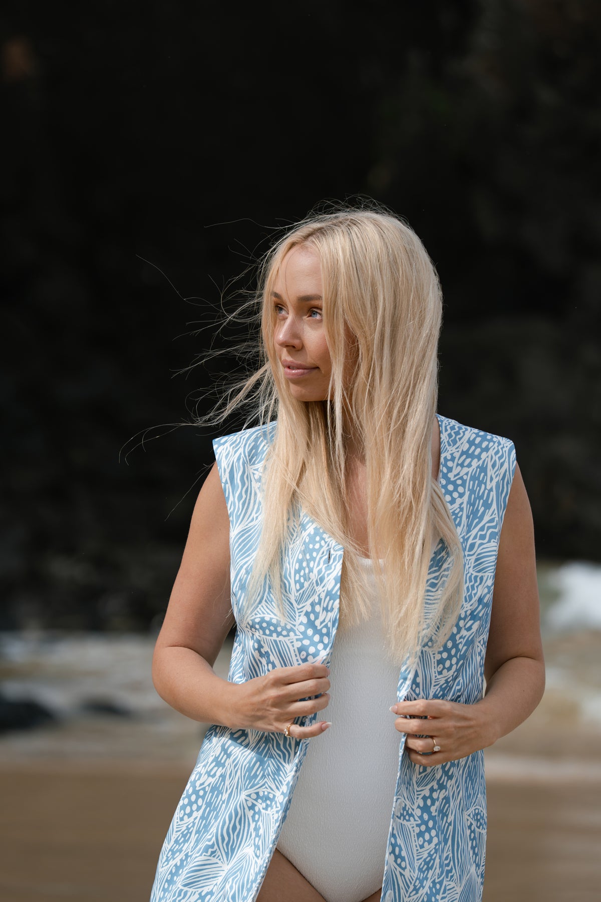 Neren Signature After-Swim Dress in Leaf Tidal worn over swimwear on a sandy beach