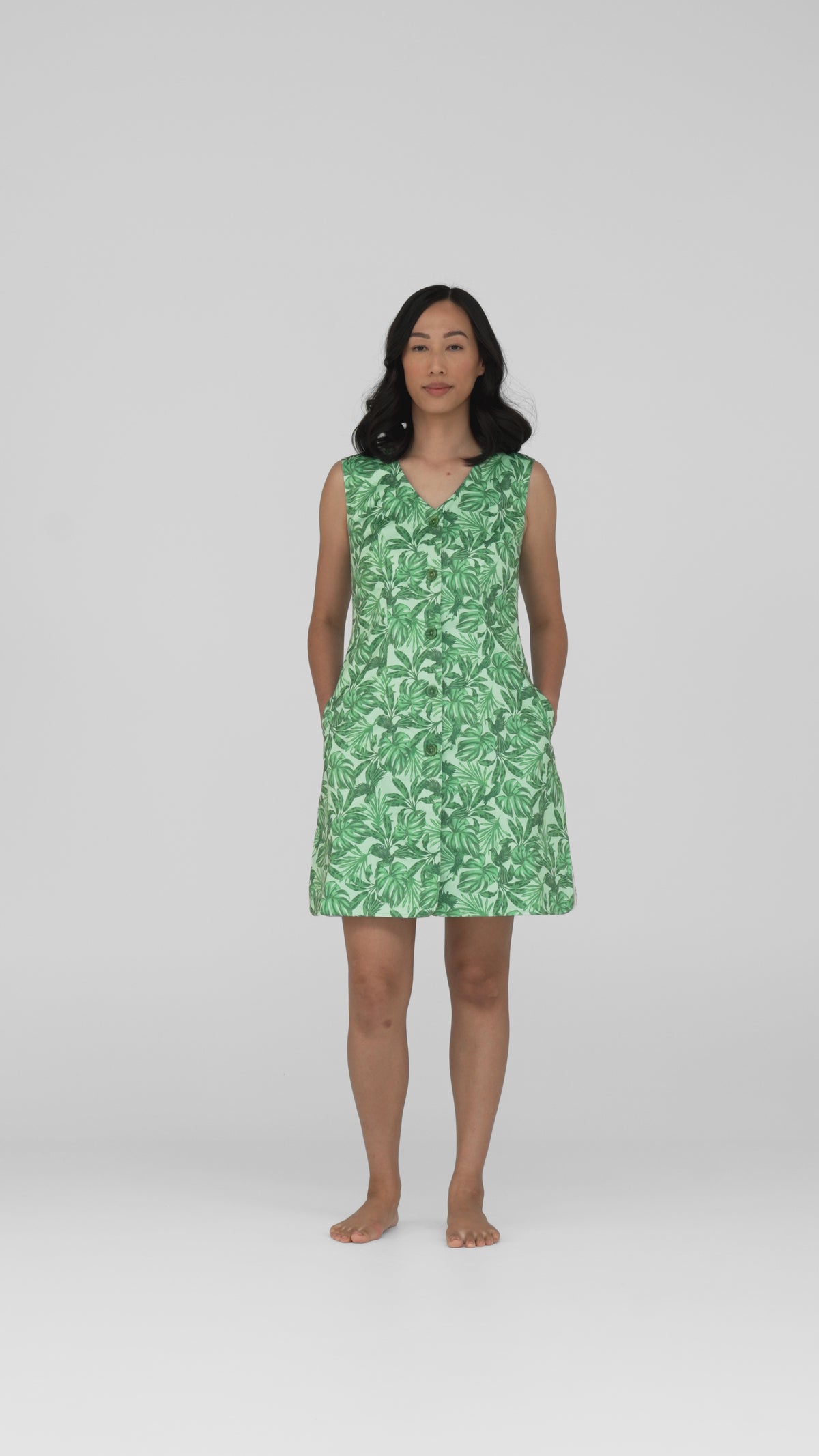 Studio video of the Neren Signature After-Swim Dress in Canopy, a green tropical leaf print