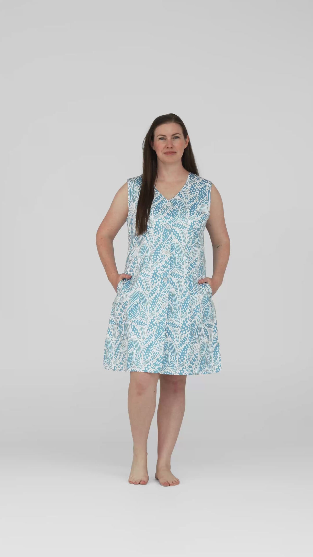Studio video of the Neren Signature After-Swim Dress in Leaf Tidal worn on a model
